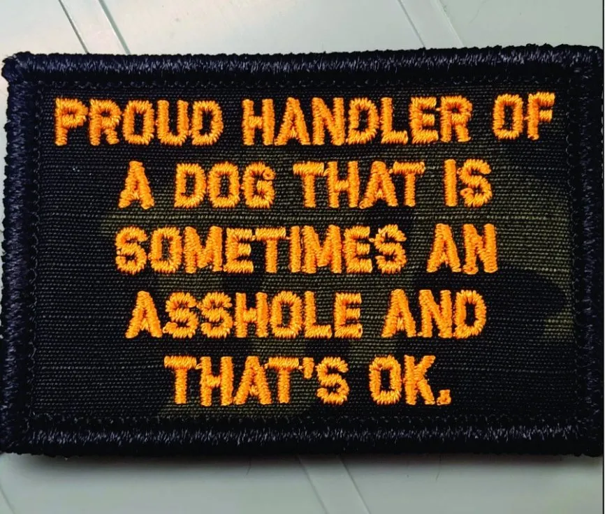 As Seen on Socials - Proud Handler of a Dog That is Sometimes an Asshole and That's Ok   - 2x3 Patch - Black w/Orange